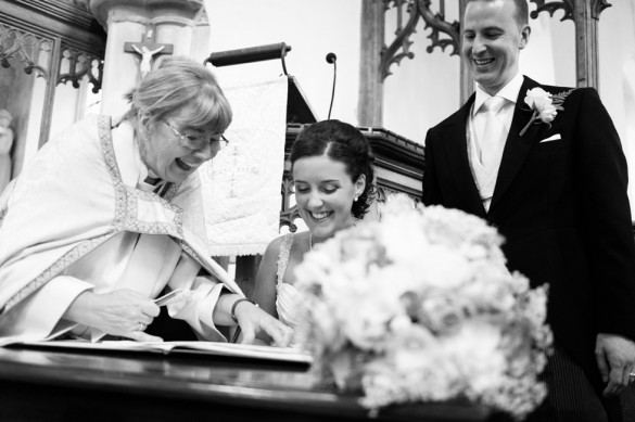 Elegant couple signing wedding register